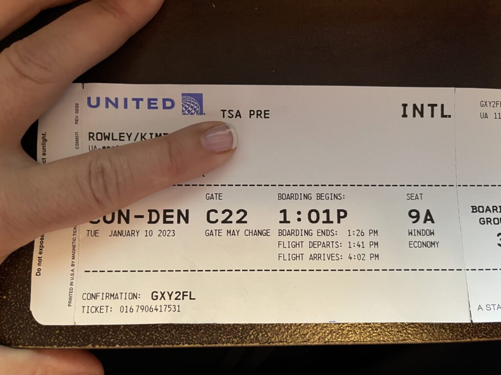 United plane ticket from Cancun to Denver showing TSA PreCheck option