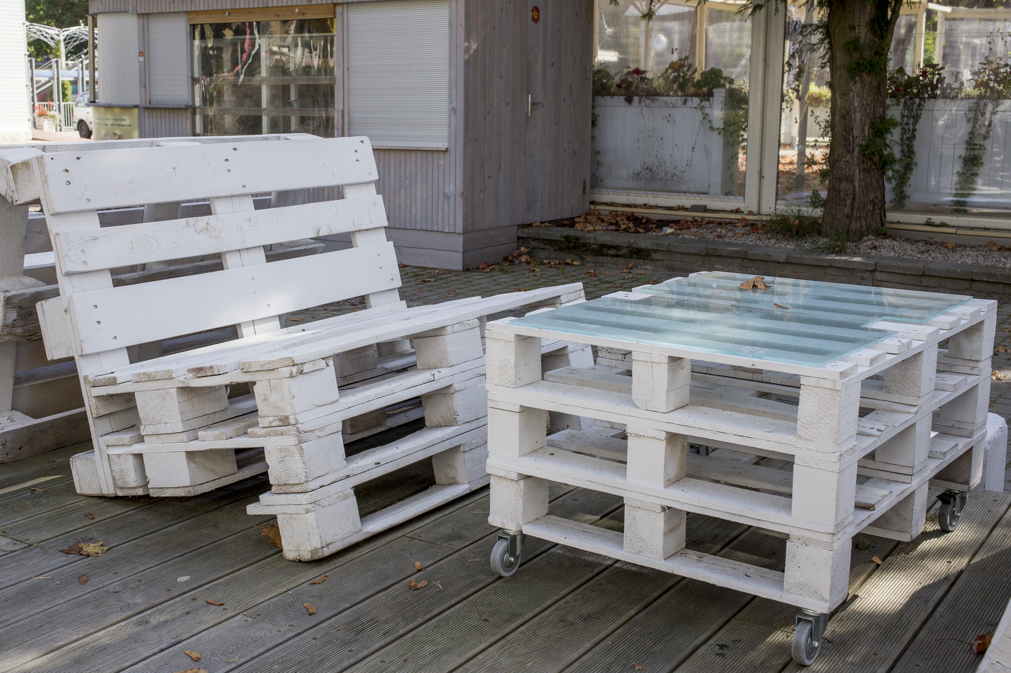 Wooden outdoor furniture from white pallets. Modern bar design.
