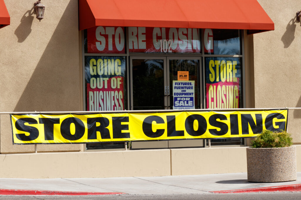 Store Closing and Going out of Business signs displayed at a soon to be closed store.