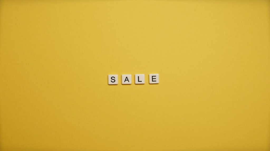 Word SALE on a yellow background