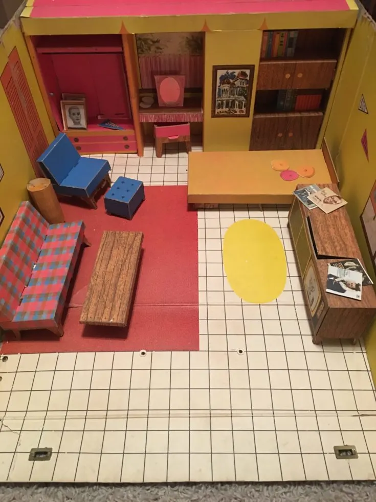Inside of 1962 Barbie's Dream House with cardboard furniture