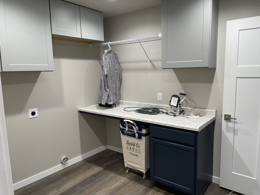 laundry room with cabinets from Home Depot liquidation store