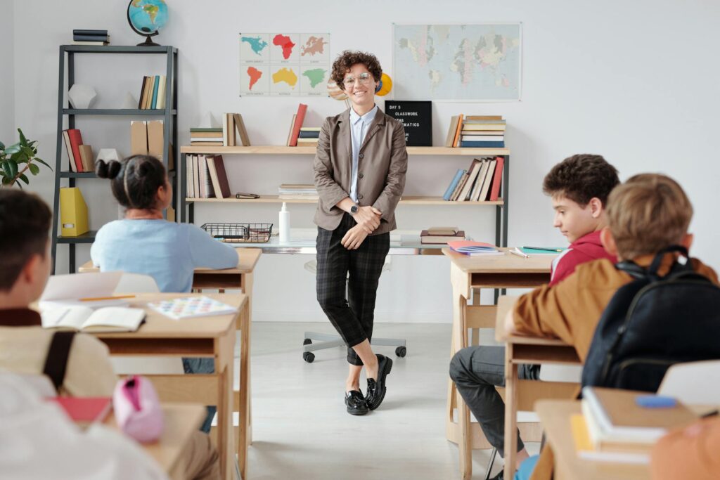 a teacher standing at the front of the class