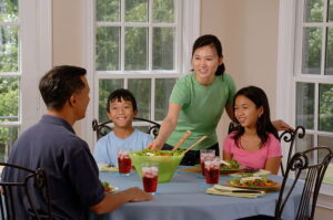 family eating dinners for $5 at less