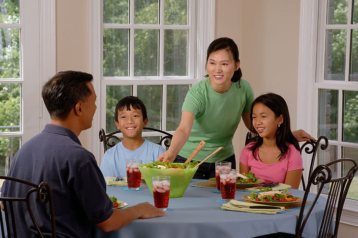 family eating dinners for $5 at less