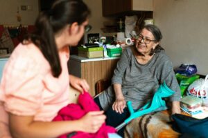 a retired woman talking to her social security payee, a social worker