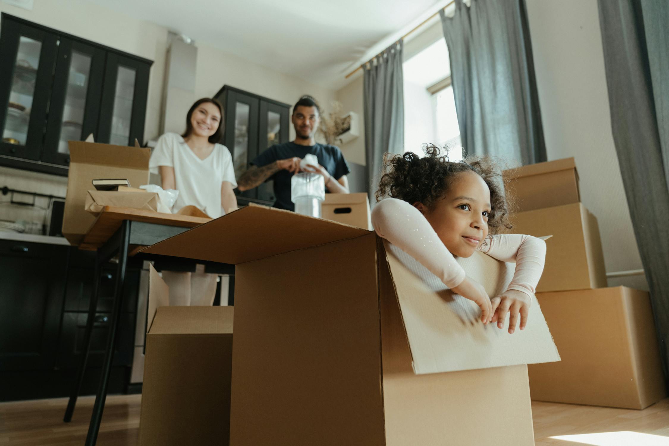 A child inside the cardboard box