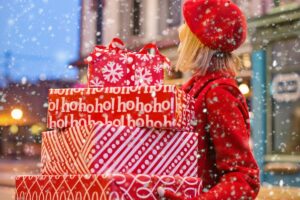 woman holding christmas presents for the holiday