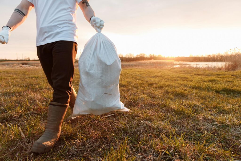 guy holding trash bag