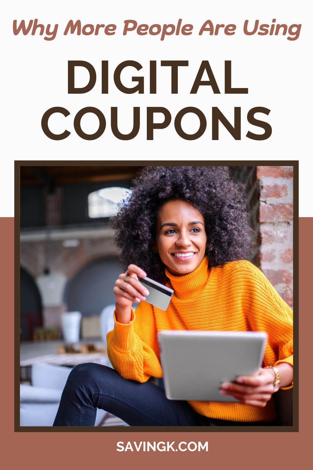 Smiling woman in orange sweater holding a credit card and tablet, representing the ease of using digital coupons to save money.