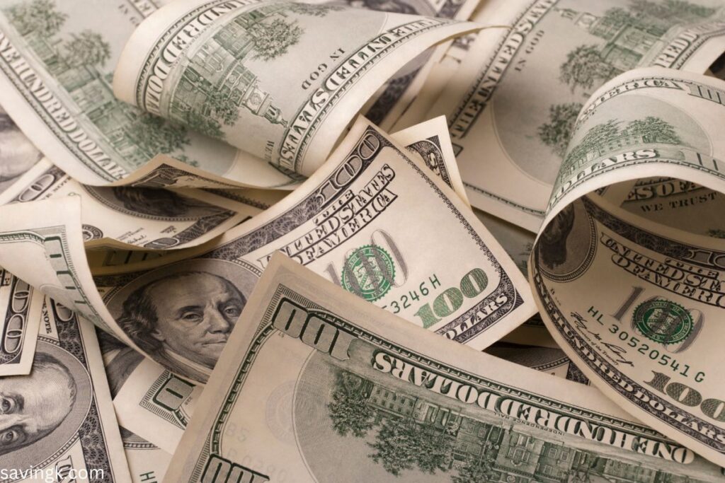 Stacks of U.S. hundred-dollar bills, representing wealth and financial success.