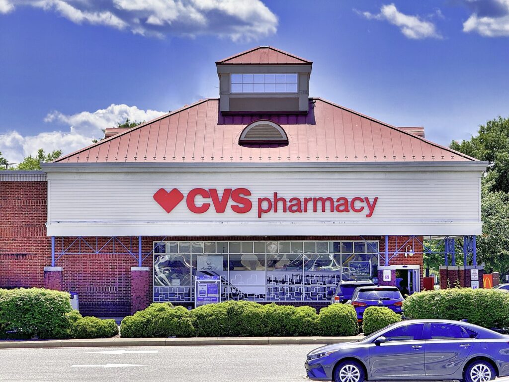 CVS Pharmacy storefront with red roof and signage on a sunny day, representing a popular destination for savings on prescriptions and everyday essentials.