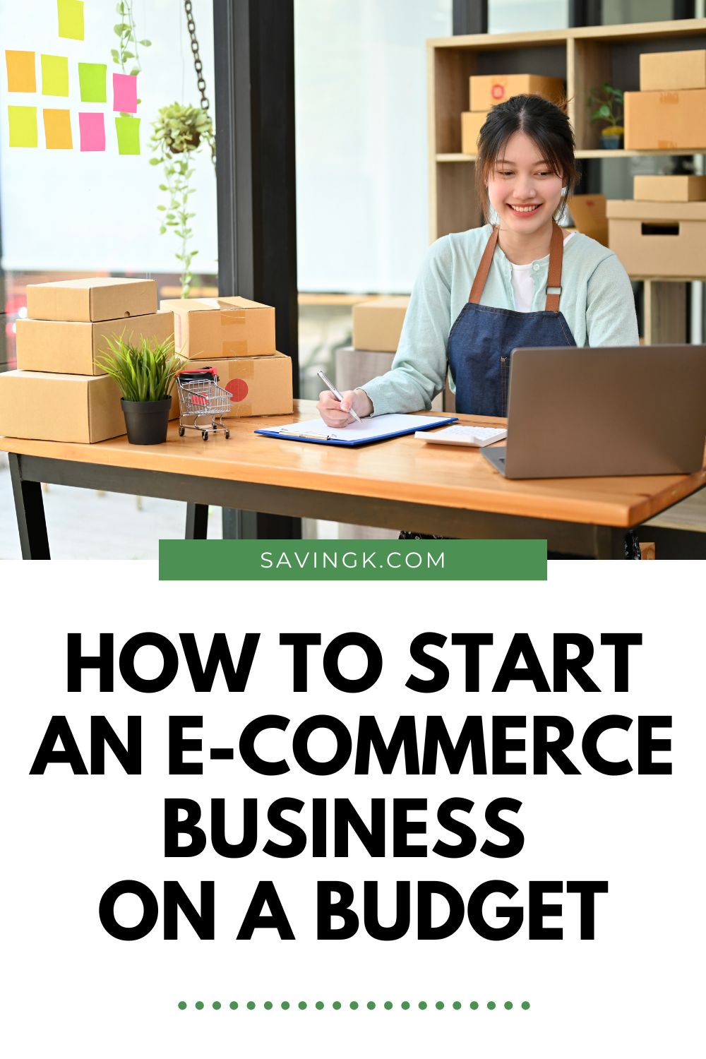 Pinterest pin showing a smiling woman working on her laptop surrounded by packages, with the text overlay “How To Start An E-Commerce Business On A Budget.”