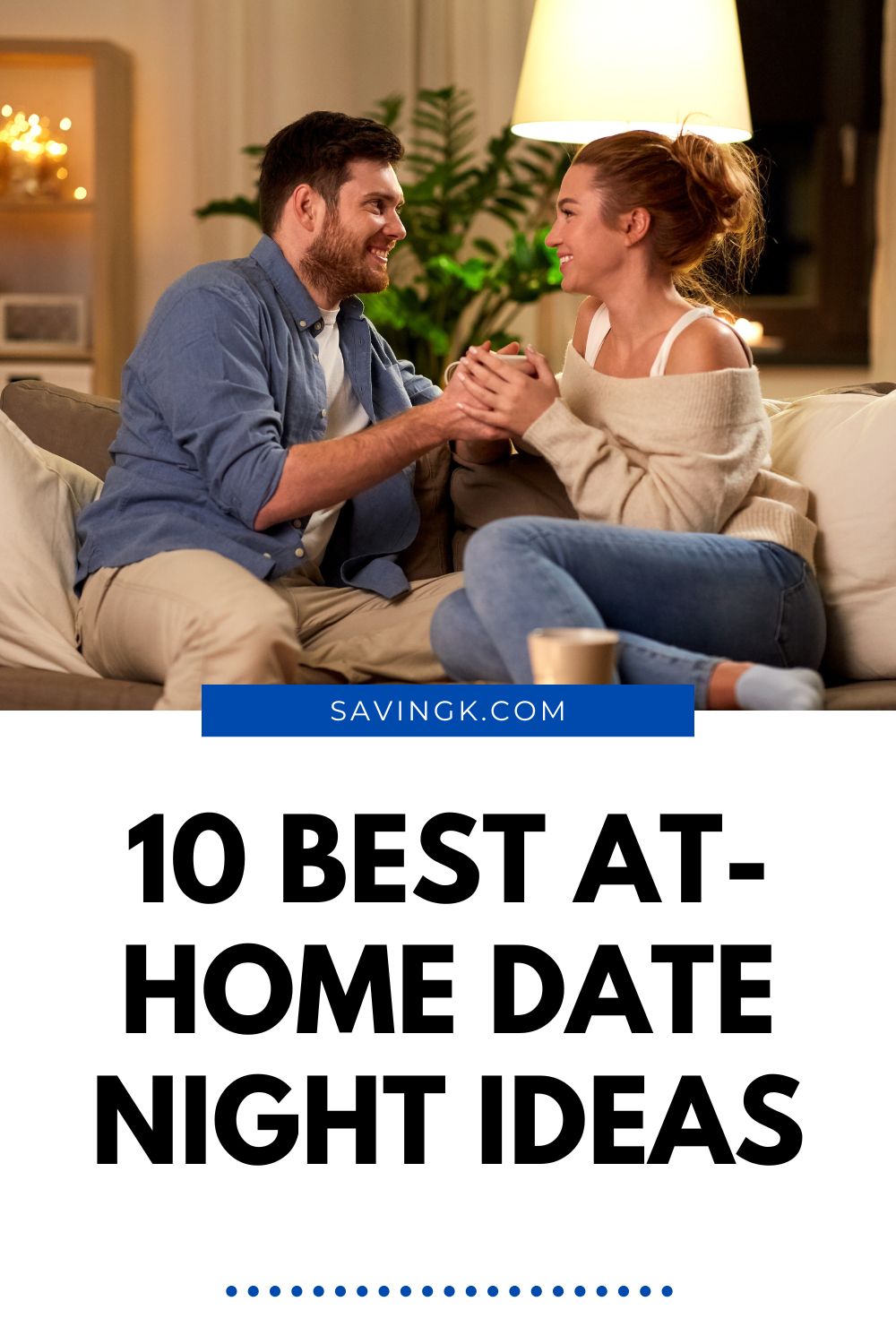 Happy couple sitting on a couch at home holding hands and smiling during a cozy date night.