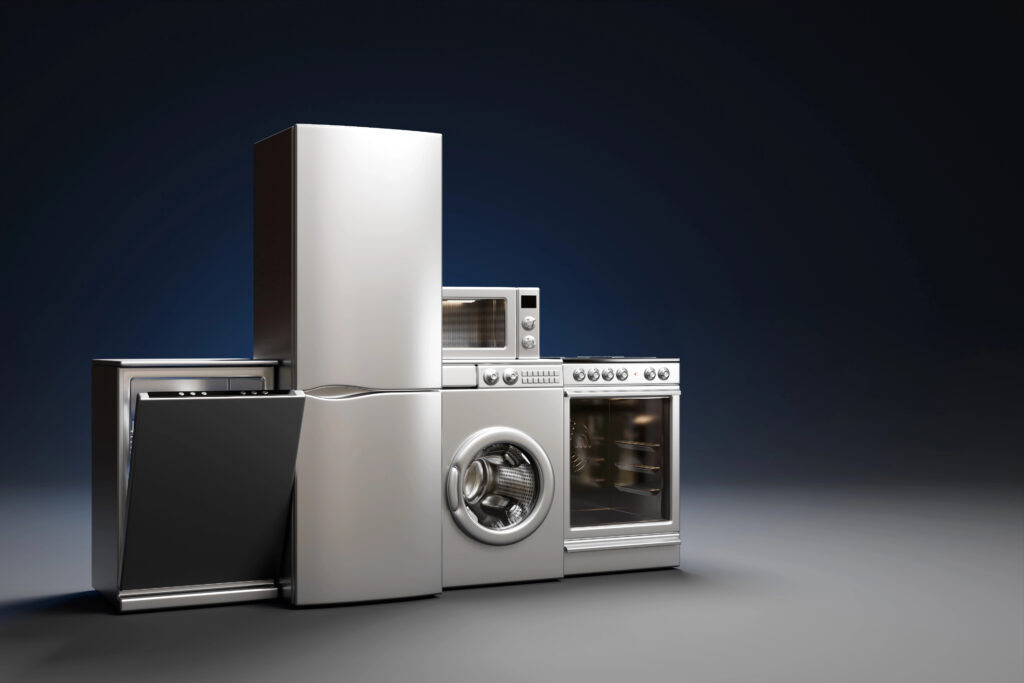 A set of stainless steel home appliances, including a refrigerator, washer, dryer, oven, microwave, and dishwasher, representing stores that offer buy now pay later options.
