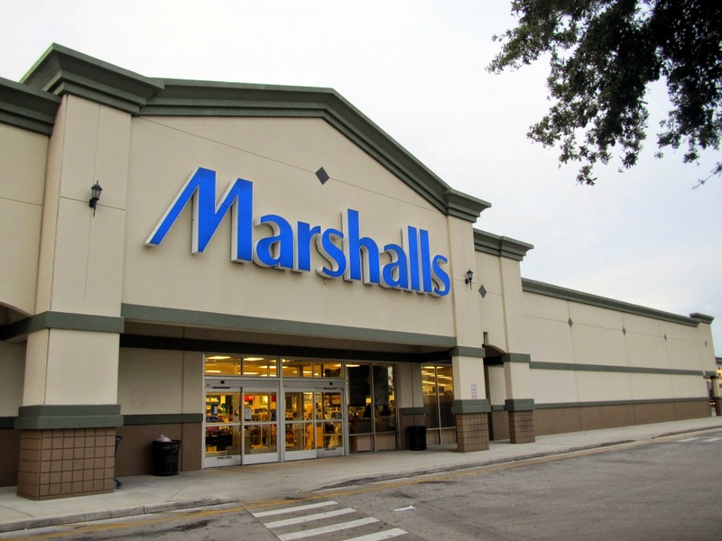 Exterior of a Marshalls store with large blue signage and glass entrance doors on a clear day.