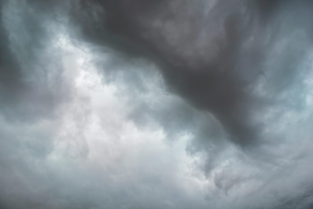 dark storm clouds gathering in the sky before a storm