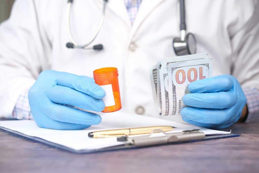 Doctor holding prescription bottle and cash representing healthcare costs and Medicare profits