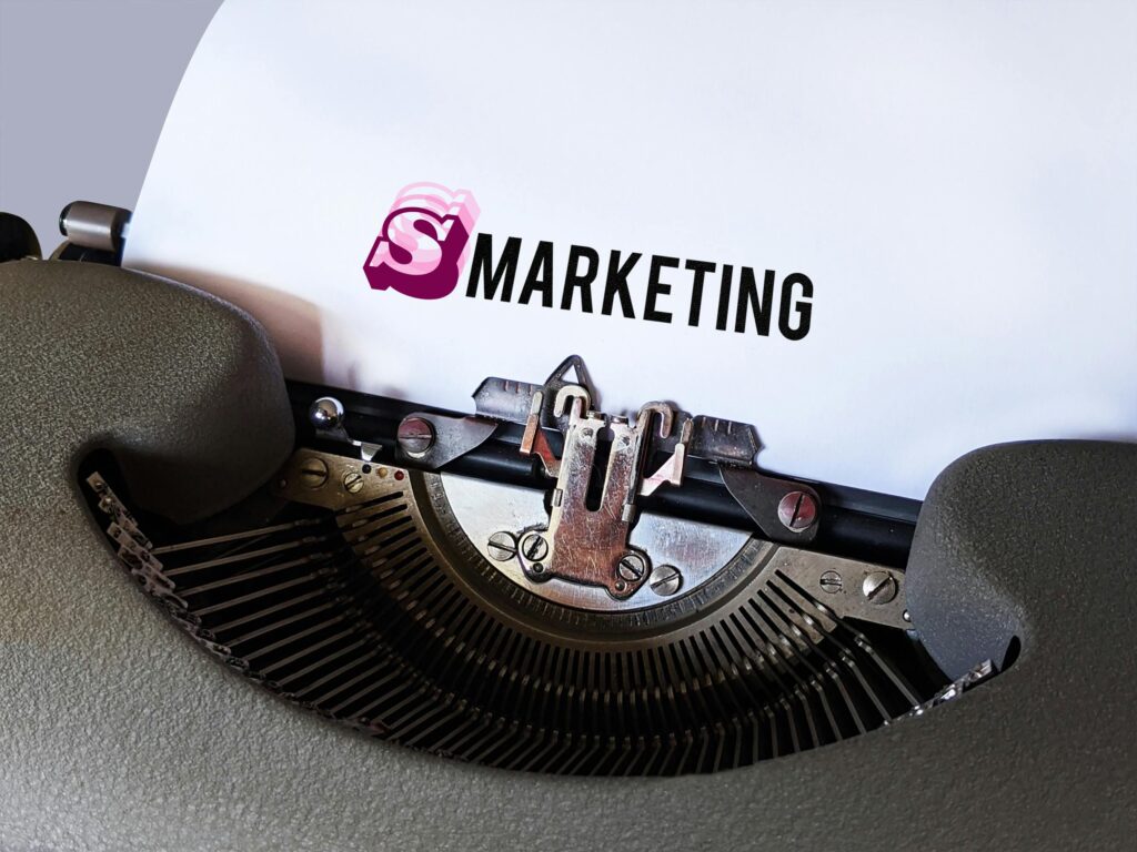 Typewriter displaying the word “Smarketing” representing the blend of sales and marketing strategies for better business results