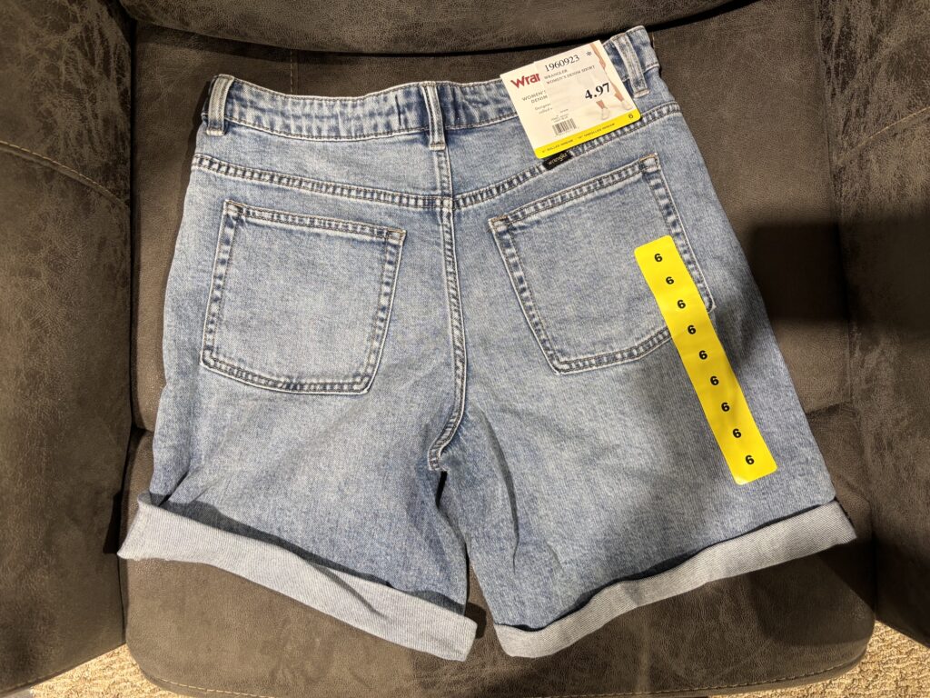 Wrangler denim shorts from Costco clearance with markdown price tag attached
