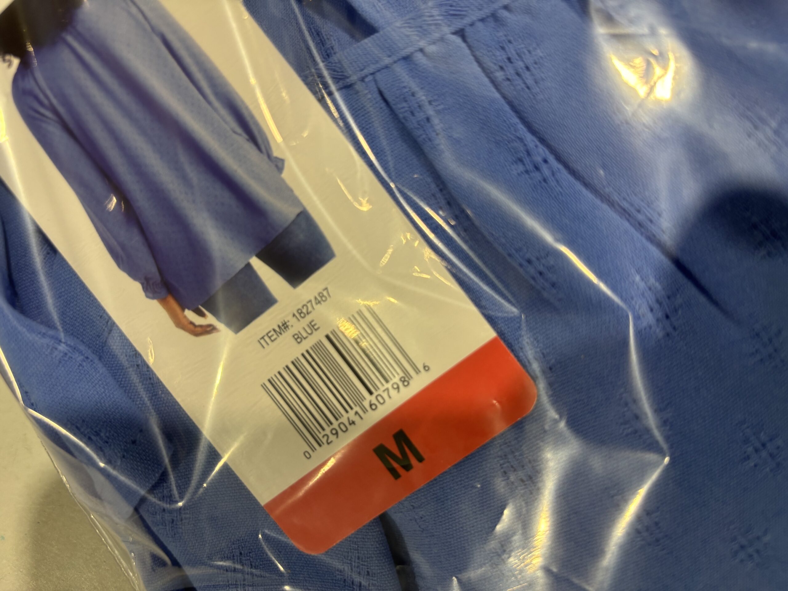Packaged blue Costco clothing item with original tags attached