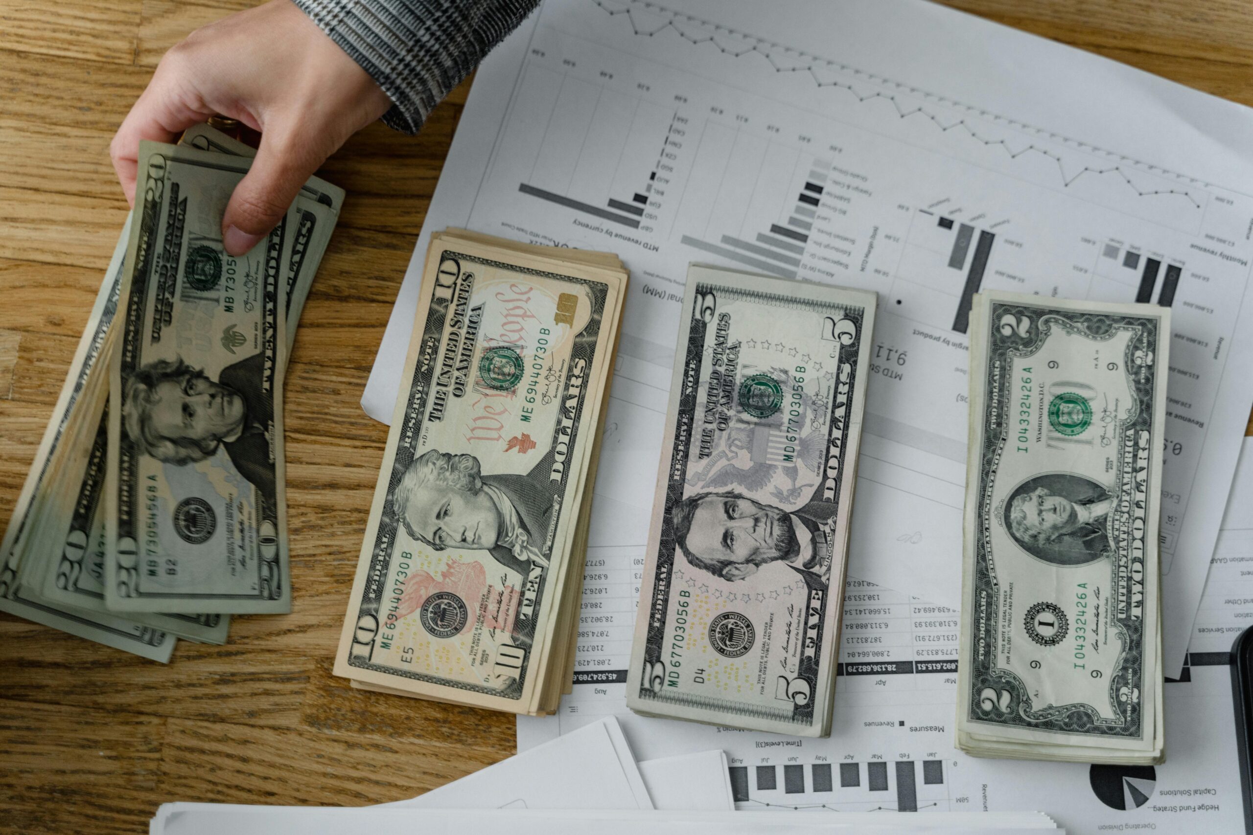 a hand counting money