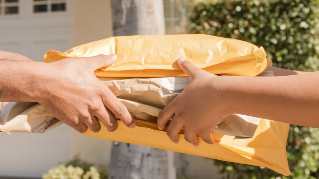 Person receiving packages in the mail representing companies that send free samples when you ask